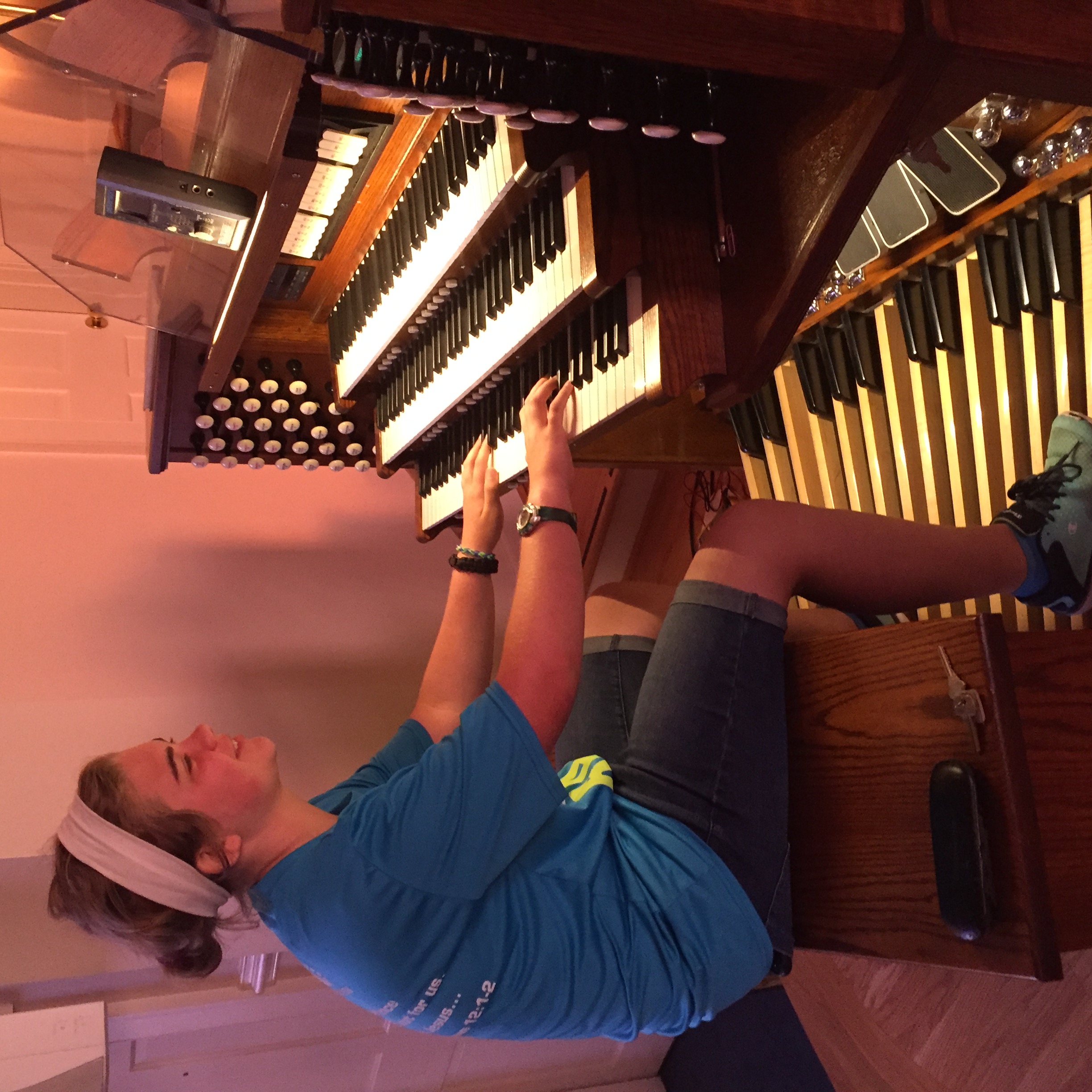 The organist's daughter helps tune