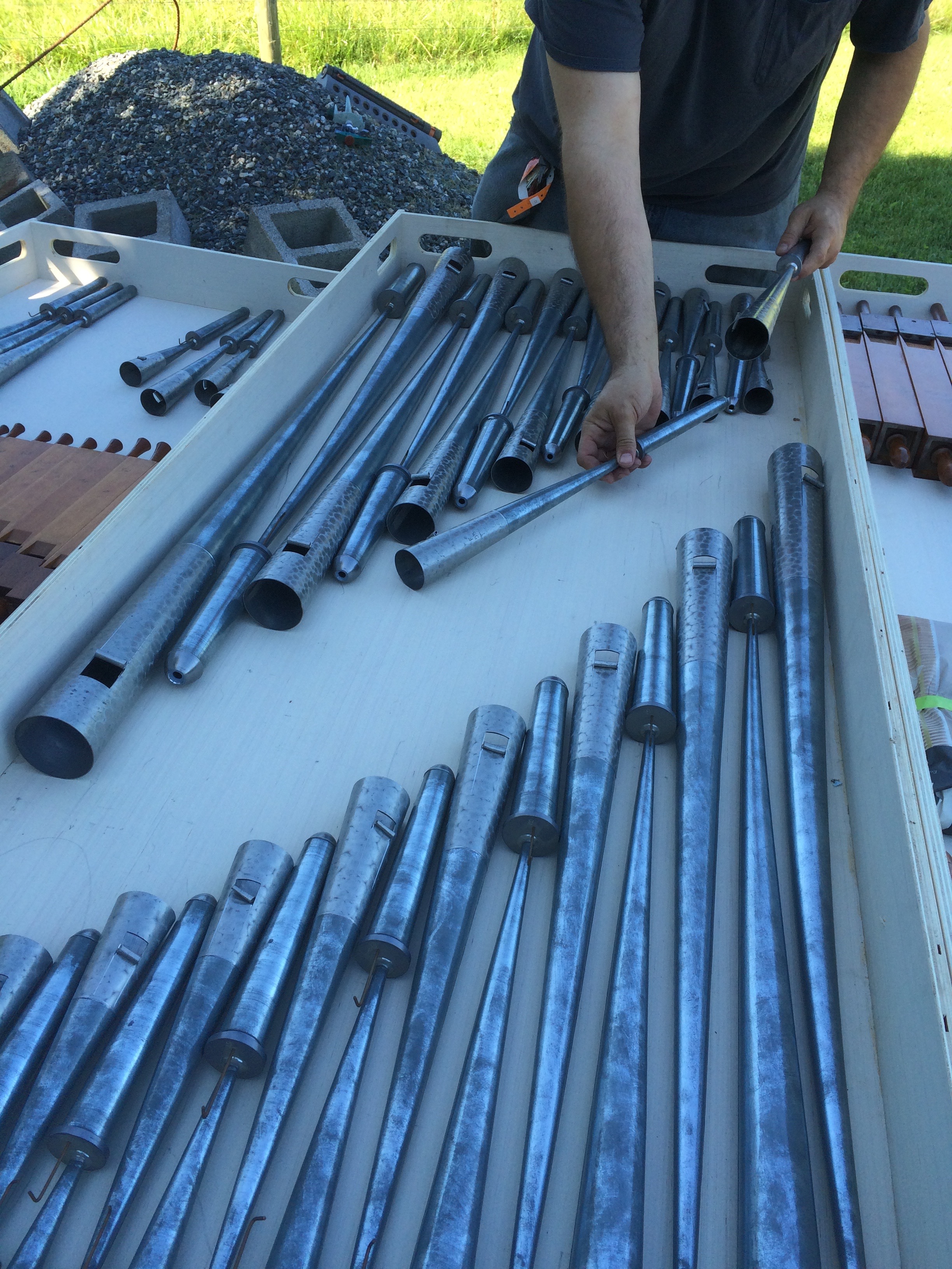 Nic carefully cleans each pipe