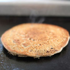 Pancake on the griddle, cooking