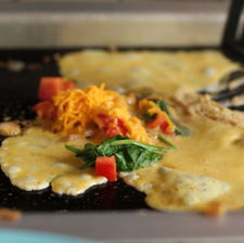 Cooking an omlete on the griddle
