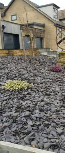 stones laid out in plant bed 