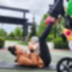 A mom having some quality bonding time with her baby during our mom workout.