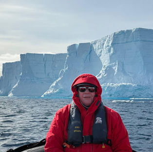 Peter Shanks in front of icebergs