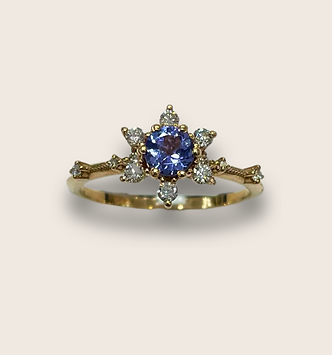 Close-up of a handcrafted 14k gold ring with fine detailing