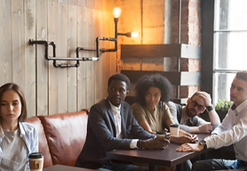 DPTrainingUK Mental Health First Aid Training. Photo; Colleague being isolated in a café