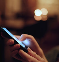 Person holding cell phone in hand