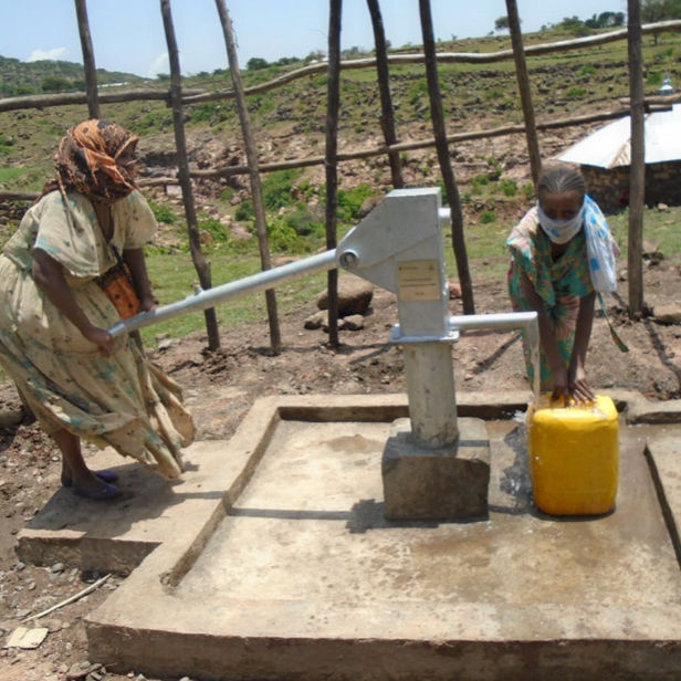 Water well in Africa and people