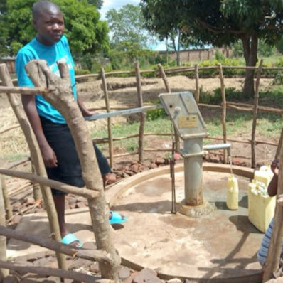 Water well in Africa and child