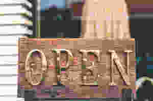 brown wooden framed gold open printed decorative signage