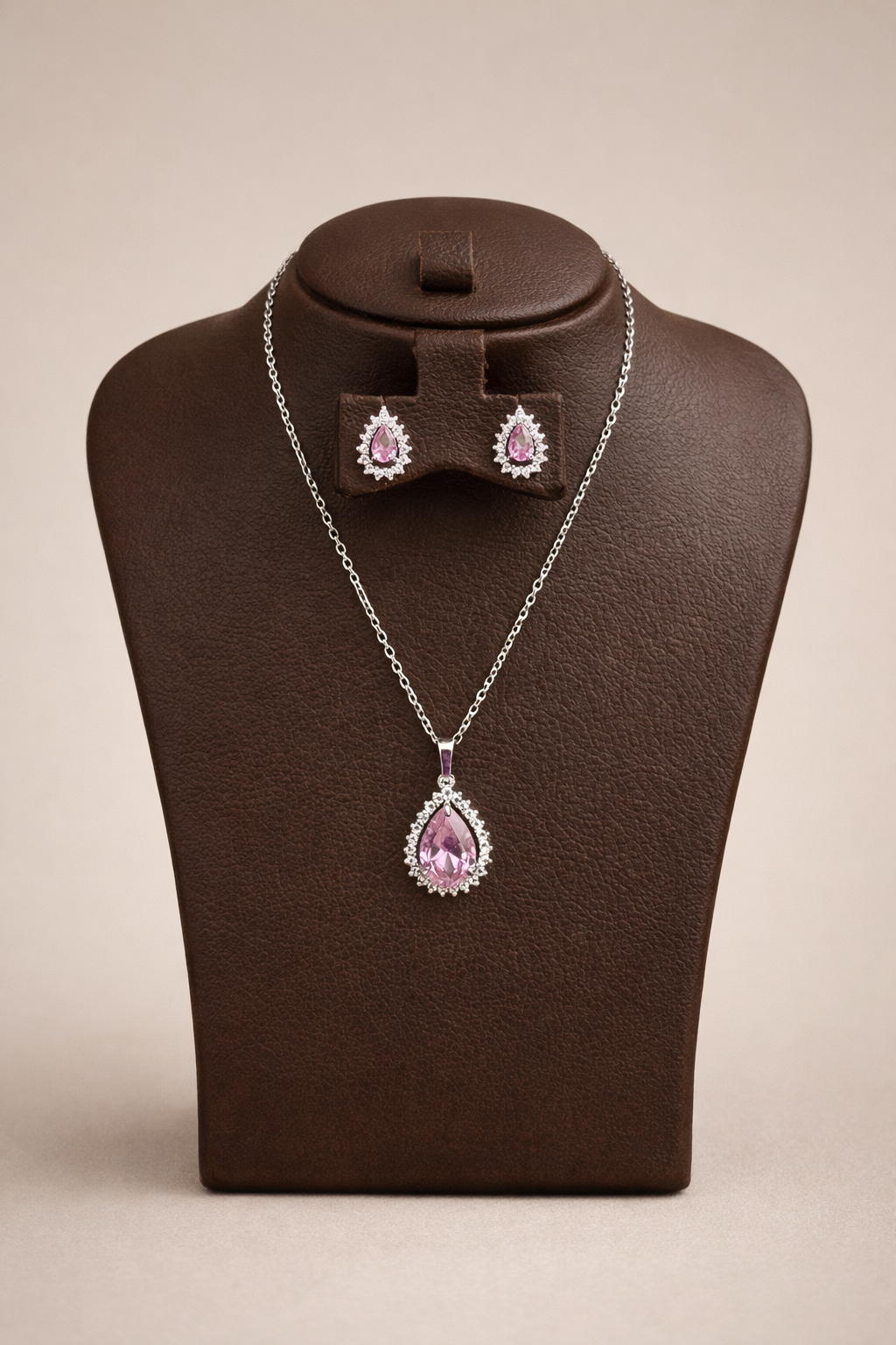 Silver necklace and matching earrings with pink teardrop stones