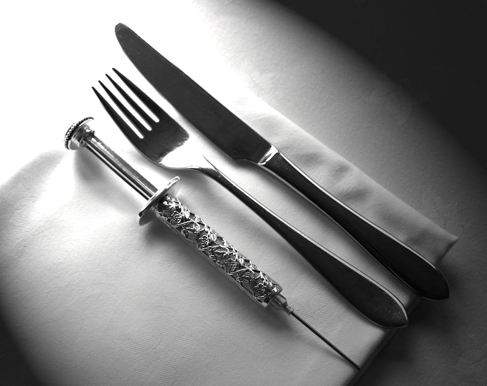 Syringe on the table setting Playing Dead Murder Mystery.jpg