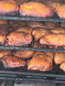Chicken thighs seasoned in the smoker