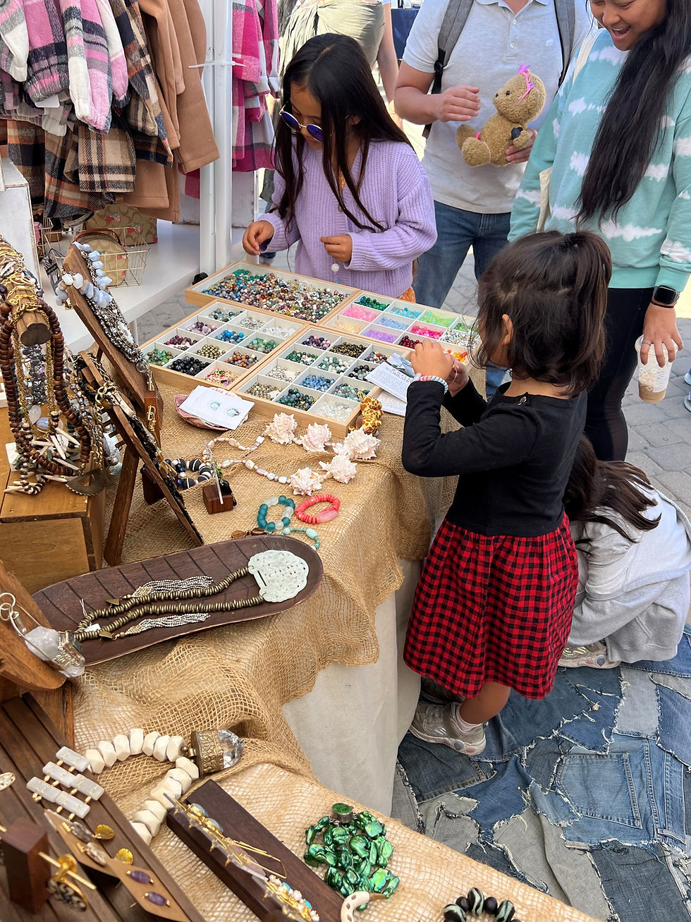 Kids bracelet making bar at pop up in Dana Point