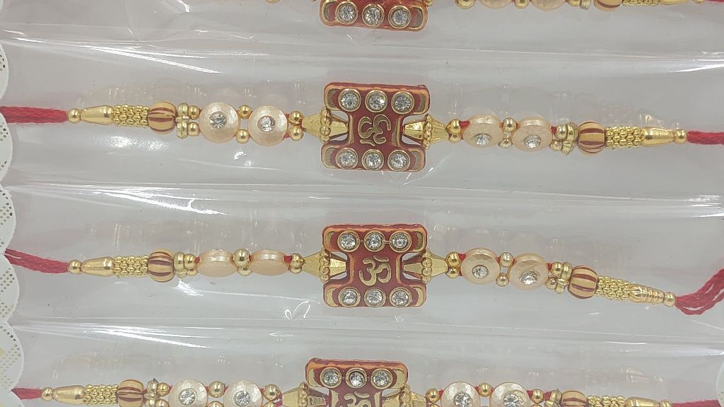 Om Rakhi with stones and pearls