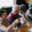 people sitting at a bar enjoying wine