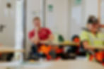 Tree surgeons sitting at a desk in a training session