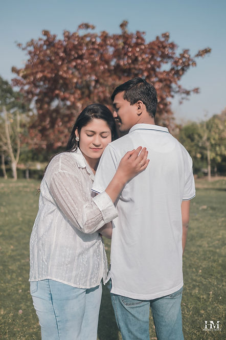 Candid close-up of a couple embracing during their pre-wedding shoot