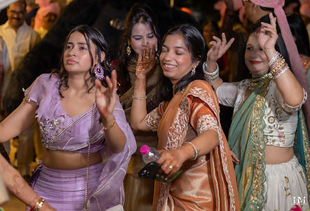 Wedding guests dancing during the groom's Baraat