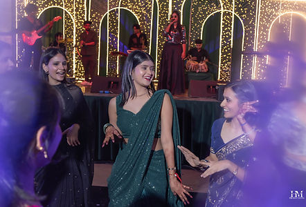 Women dancing together during an Indian wedding sangeet