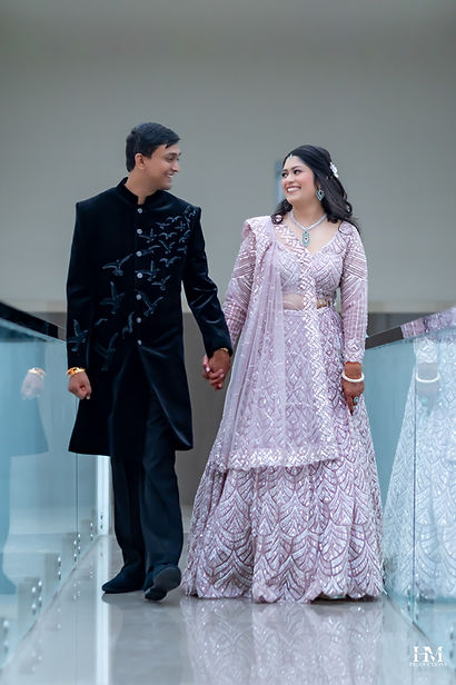 Bride and groom in elegant wedding outfits during their wedding celebration