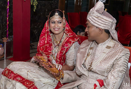 Bride and groom seated together during traditional Hindu wedding rituals