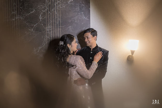 Candid portrait of bride and groom embracing at their wedding