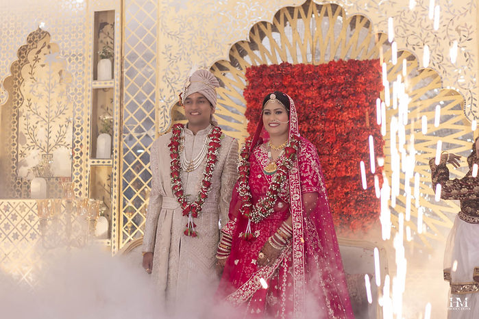 Bride and groom standing together during their traditional Indian wedding ceremony