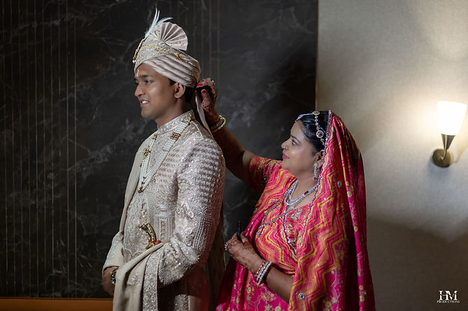 Groom and mother during wedding preparations