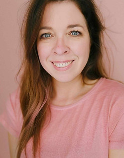 Portrait of artist Dawn Hunter wearing a pink top.