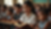 Close-up view of a Sunday school teacher reading from a Bible with children listening attentively