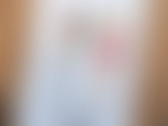 A cotton tea towel on a wooden cutting boarad