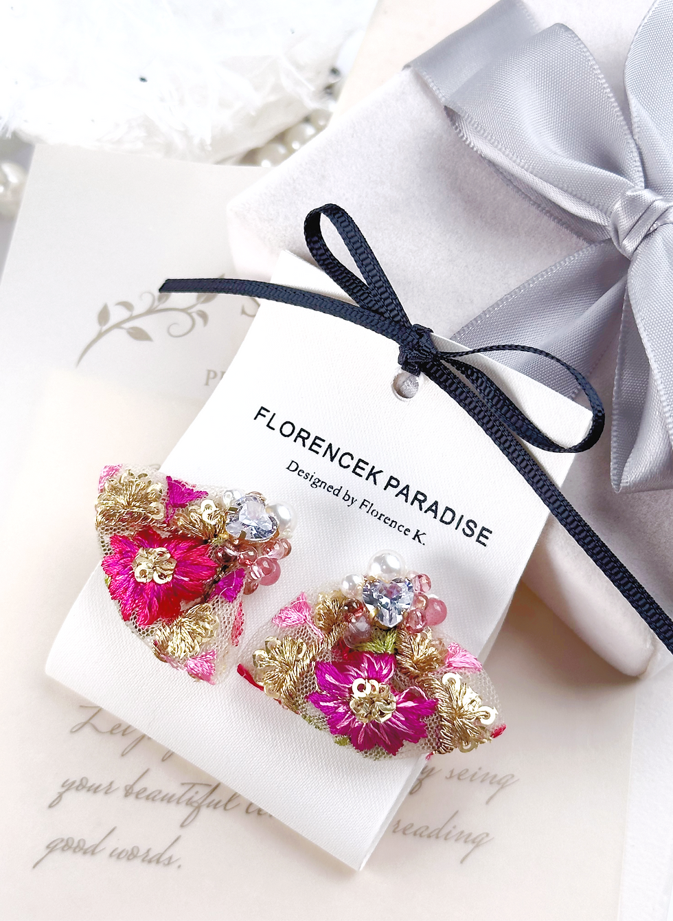 This is a pair handmade Embroidered  fabric Earrings, featuring intricate designs with vibrant colors and floral patterns.