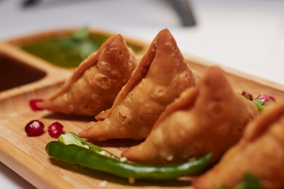 Hot Indian street food and snacks enjoyed during monsoon rains in Agra