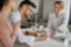 happy-man-his-wife-having-meeting-with-financial-advisor-signing-agreement-office.jpg