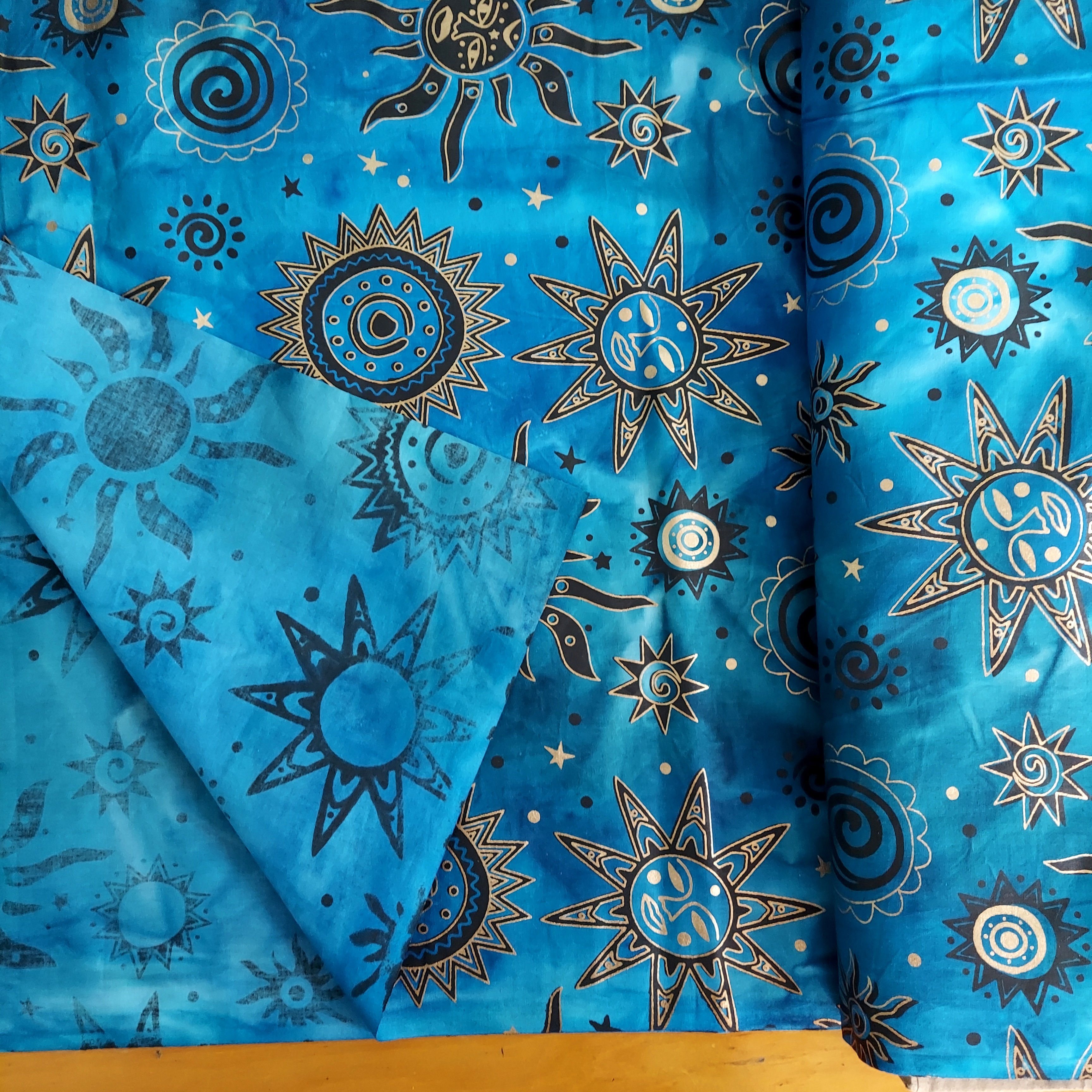 Black w/Gold on Blue Sun and Stars Odyssey OY-156 Cotton Batik Fabric