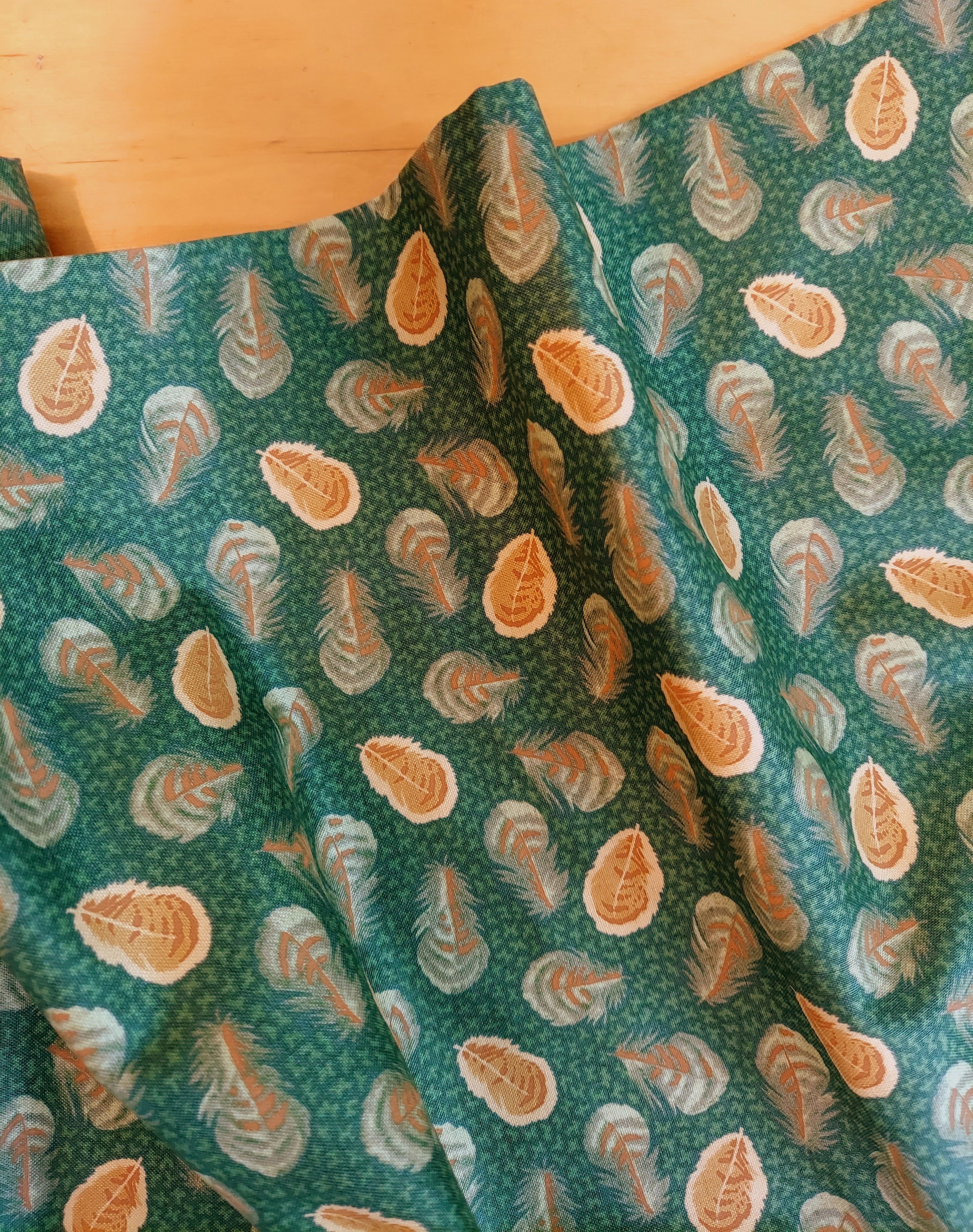 Henry Glass Coq Au Vin Feathers on Green Cotton Fabric