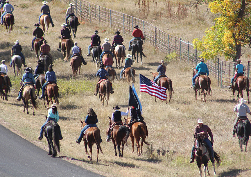The riders rounding up the Buffalo Photo by Larry Kiewel