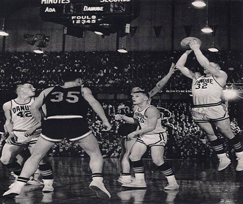 Bob Bruggers of Danube, right, scores the first two points of the 1962 State Basketball Tournament. The other two Danube players are Jerome Roelofs (42) and Mike Gort (20). Bruggers was one of the most prolific prep athletes in Minnesota history. Contributed photo