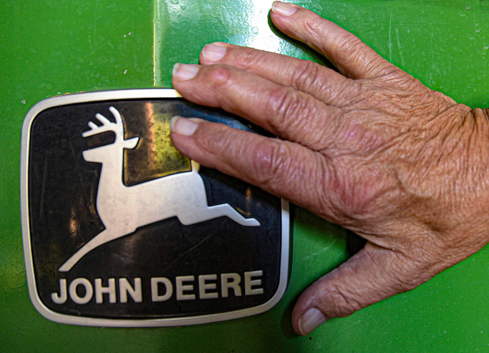 Duane Haug’s hand on one of the tractors in the larger barn. Photo by Maggie Gray