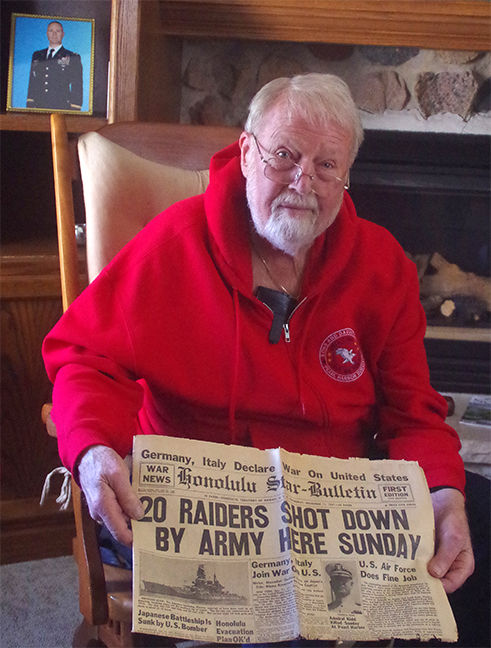 Nick Johnston of St. Cloud displays the “Honolulu Star-Bulletin” newspaper describing the attacks on Pearl Harbor of Dec. 7, 1941.
Photo by Bill Vossler