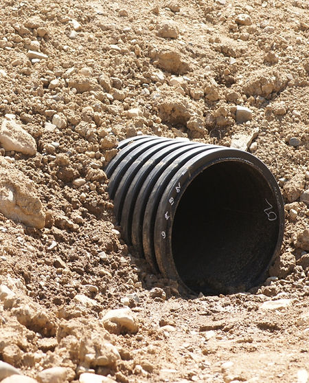 Road culvert installed to direct water a