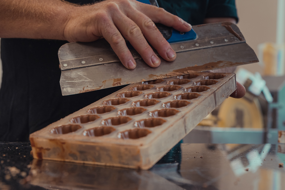 Close-up view of assorted handcrafted chocolates in a luxury box