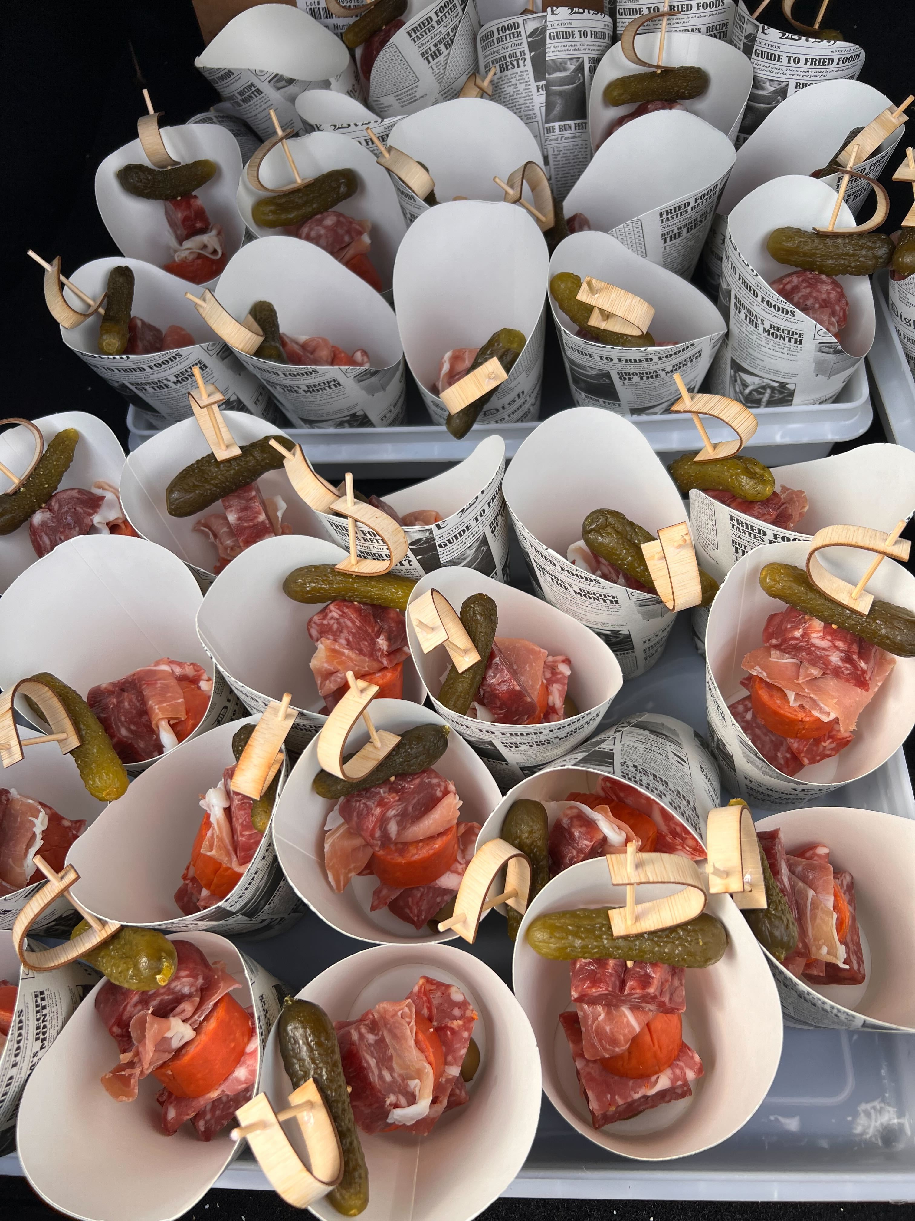 Charcuterie tasting cups with cured meats and pickles