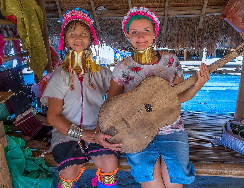 Posing for a photo at the Karen Long Neck village near Chiang Rai