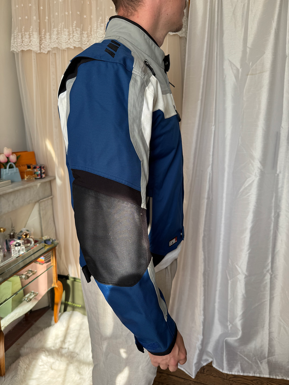 Miniature : Manteau moto taille s bleu blanc et gris en très bon état malgré de petites ta
