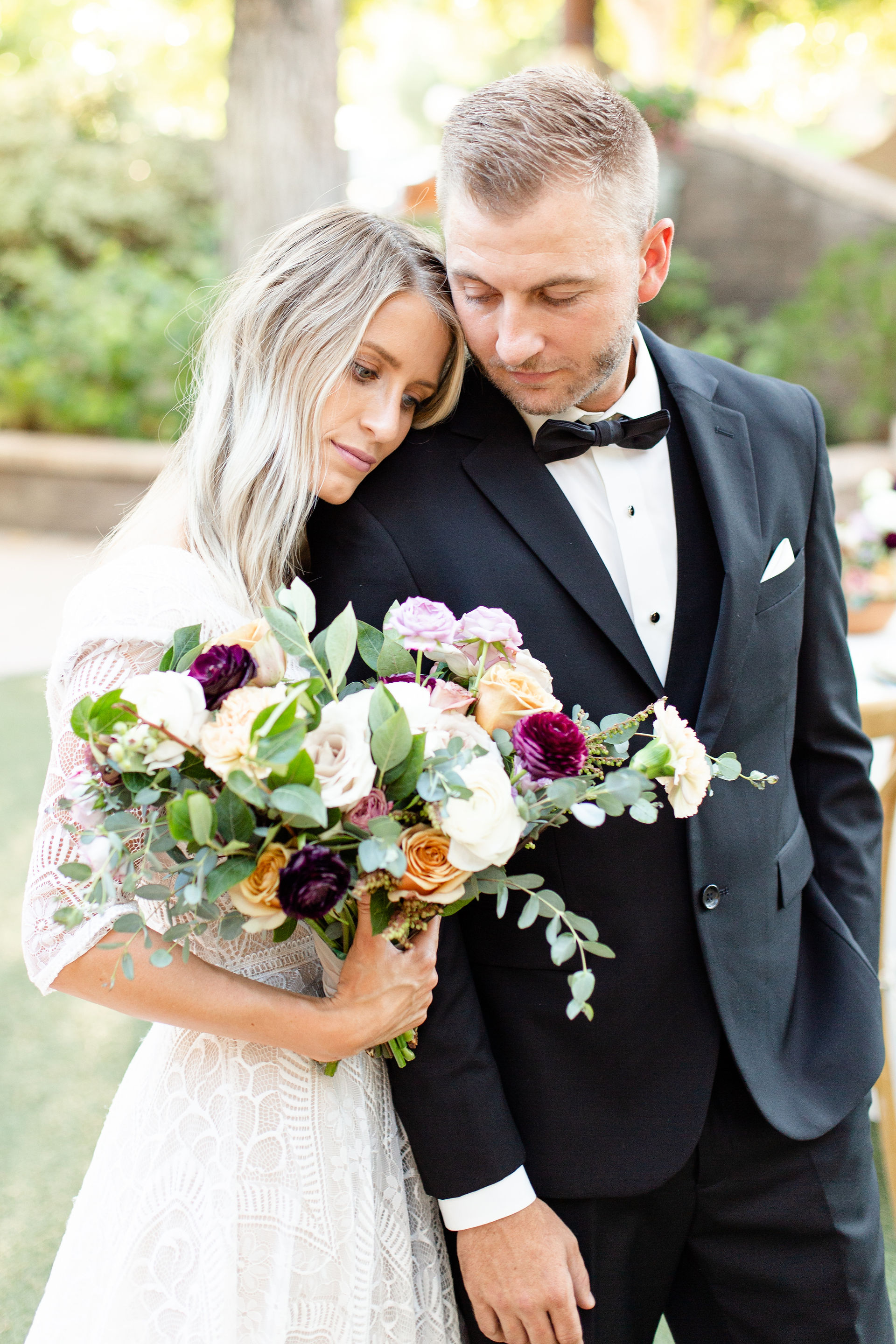 bride and groom -- groom in black tuxedo with bowtie