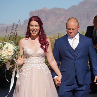groom's custom blue suit with pink Hayley Paige bridal gown