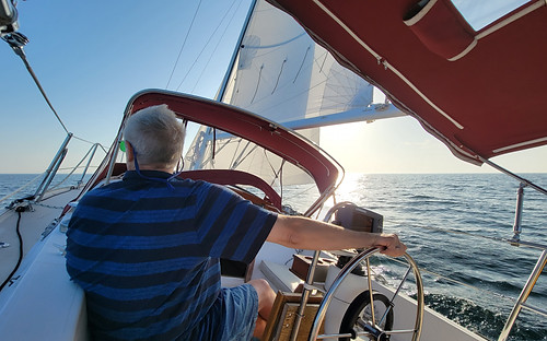 man in blue shirt sailing
