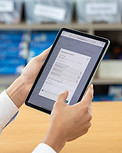 A teacher using the Pageticker app on a tablet