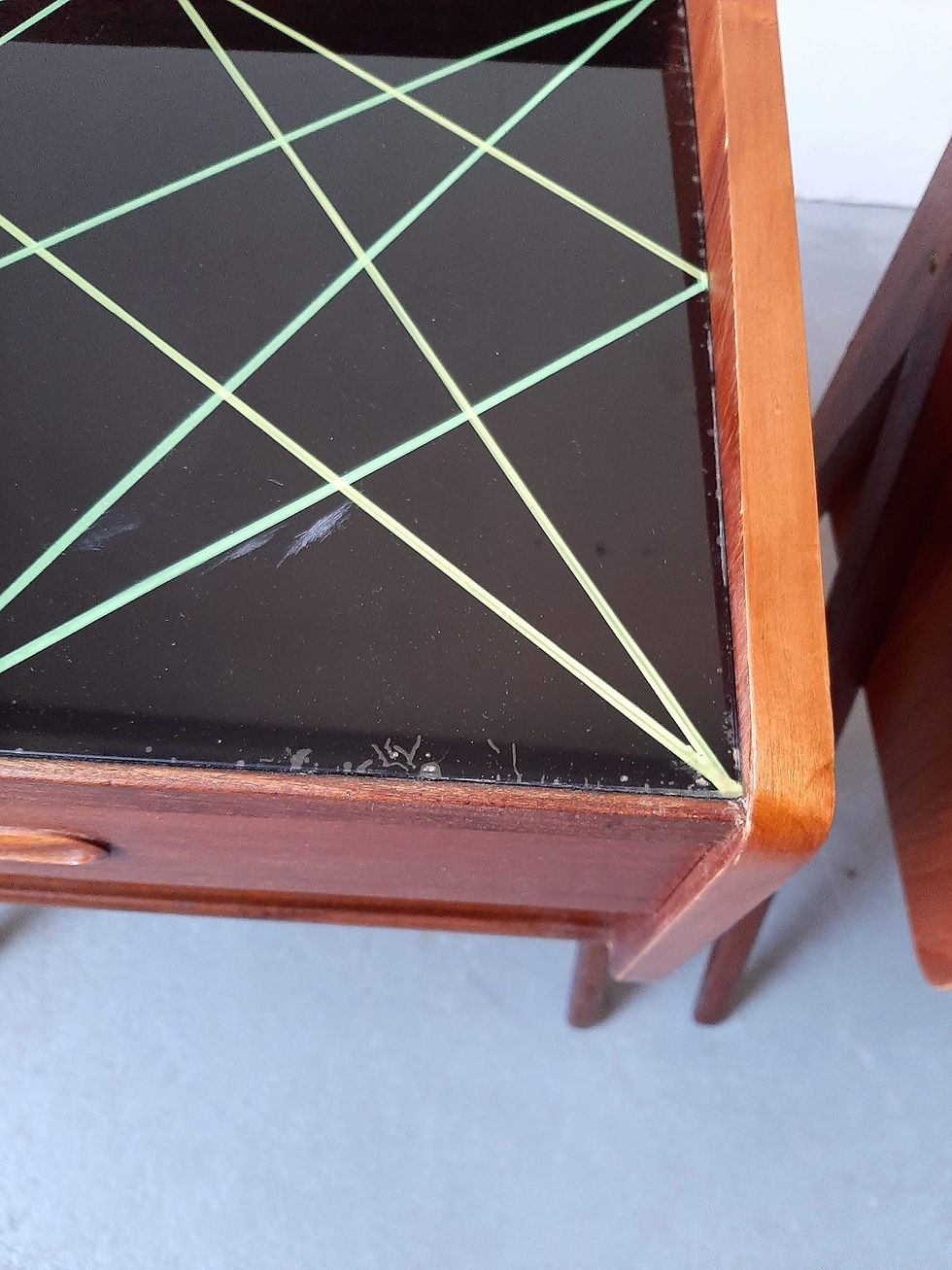 Thumbnail: Pair of 1950s Danish Bedside Tables with black and yellow glass tops